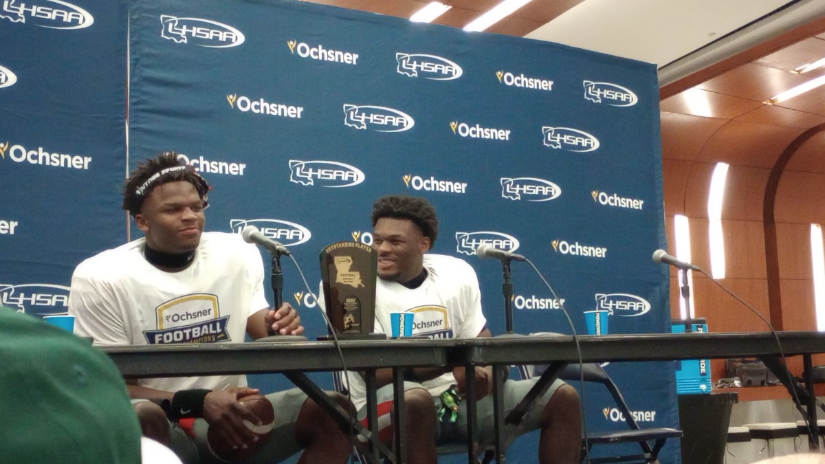 Ruston quarterback Joshua Brantley (left) and linebacker Jadon Mayfield share a laugh during a postgame press conference following the Bearcats' Division I non-select title win on Dec. 9, 2023.